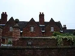 Willoughby Almshouses and adjoining boundary wall