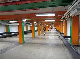 A pedestrian tunnel with brightly painted pillars