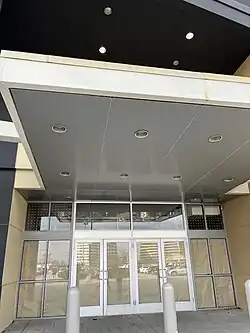 A bordered up former Sears store entrance.