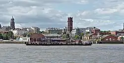 Woodside ferry terminal and its landing stage seen from the River Mersey, with Birkenhead in the background