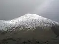 Y Lliwedd in snow from the flank of Yr Aran