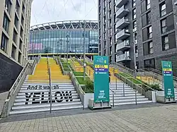 Yellow staircase leading to one of the Wembley Stadium gates