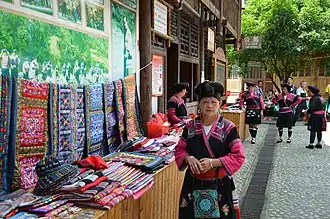 Woman selling textiles at an outdoor market