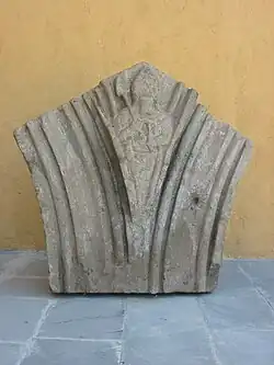 Ruins of Zvartnots. Spandrel of the blind arcade containing a depiction of a mason