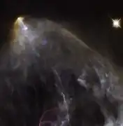 A wider view of the region (HL Tauri out of frame at bottom right corner) from the Hubble Space Telescope in visible light shows the Herbig–Haro object HH 150.[17]