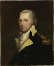 Portrait shows a white-haired man in a dark blue military uniform with buff lapels and gold epaulettes.