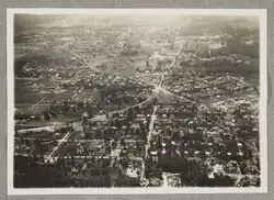 Aerial view of Clarendon ca. 1921–1924. The convergence of two trolley lines is visible near the center of the image