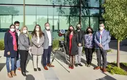 Photo of government officials and researchers in masks in 2022