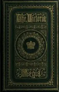 Book cover showing a large, deep blue volume. The words "Victoria Regia" are prominent in the center, in a large, heavy, old-fashioned font, with gold embossed lettering. The title is surrounded by gold-embossed scrolls.